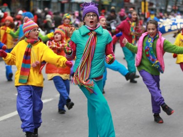 Girls, part of the troupe called Toupies Dance take part in the 64th edition of the downtown Santa Claus parade in on Ste-Catherine St. in Montreal Saturday, November 22, 2014.
