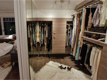 A walk-in closet in the master bedroom.