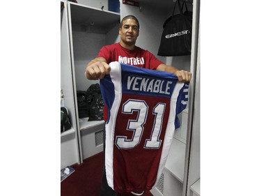 Montreal Alouettes Winston Venable shows off his game jersey before packing it with his things as the team cleaned out their lockers at the Olympic Stadium in Montreal Monday November 24, 2014 one day after ending their season with a loss to Hamilton in the CFL Eastern Final.