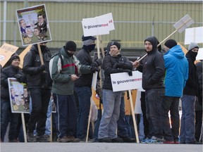 Protesters block an entrance to the port of Montreal at Pie-IX Blvd., Nov. 26, 2014, as part of a day of protests across the province against Bill 3.