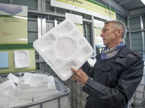 François Beauchesne of Polyform examines some of the styrofoam collected at the St. Patrick Eco Centre in LaSalle during a press conference in Montreal, on Thursday, November 27, 2014.