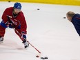 Canadiens coach Michel Therrien watches closely as centre David Desharnais takes extra shots on net during  practice at the Bell Sports Complex  in Brossard on Nov. 27, 2014.