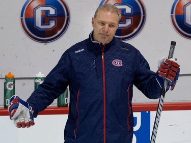 Montreal Canadiens head coach Michel Therrien gestures to the team after running a drill during a team practice at the Bell Sports Complex  in Montreal on Thursday November 27, 2014.