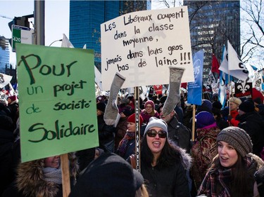 People take part in an anti-austerity protest in downtown Montreal on Saturday, November 29, 2014.