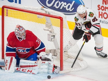 Chicago Blackhawks right wing Marian Hossa  attempts a shot on Carey Price during the first period at the Bell Centre on Tuesday, Nov. 4, 2014.
