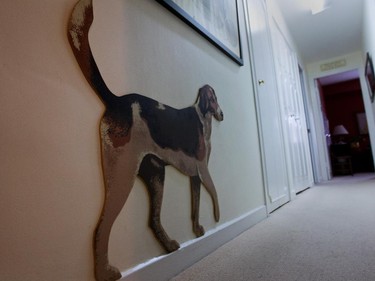 A cut-out of a dog in a hallway.