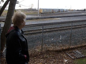 Luba Lallouz  looks out at the St-Luc Yards from a vantage point a couple of feet from the corner of her back yard in the Hampstead area of Montreal Wednesday, November 5, 2014. Montreal seems to be backing down on a promise to limit development and impose minimum setbacks along railway lines in the wake of the Lac-Mégantic accident.