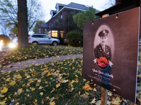 A poster of Charles Dexter Schnebly on the front lawn of 124 Brock N. in the Montreal West area of Montreal Thursday, November 6, 2014. There are 33 posters featuring 33 men who died in combat in the Second World War and who had a connection to Montreal West.