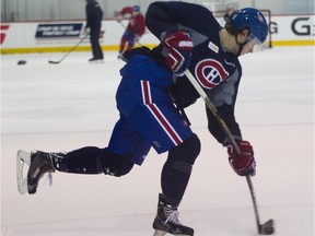 Canadiens defenceman Nathan Beaulieu takes a slapshot during practice at the Bell Sports Complex in Brossard on Nov. 7, 2014.