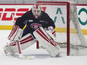 Canadiens backup goalie Dustin Tokarski  gets set to make save during practice at the Bell Sports Complex in Brossard on Nov. 7, 2014.