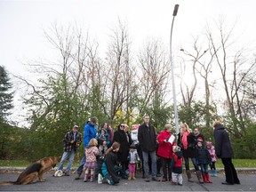 Beata Tarcsy, in red, stand in front of the future site of townhouses on Kirkstone Avenue near the corner of Highgate in Pointe-Claire.