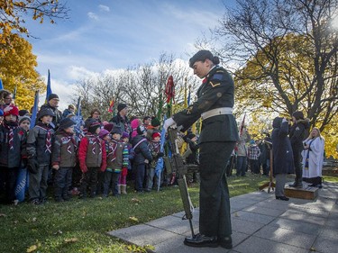 A Canadian soldier stands guard at the the Pointe Claire Cenotaph on Sunday, November 9, 2014.