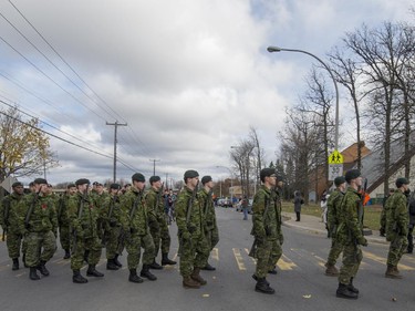 Canadian soldiers from the Royal Montreal Regiment march to the Pointe Claire Cenotaph for memorial day services on Sunday, Nov. 9, 2014.