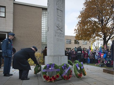 Wreaths are placed at the base of the Pointe Claire Cenotaph on Sunday, Nov. 9, 2014.