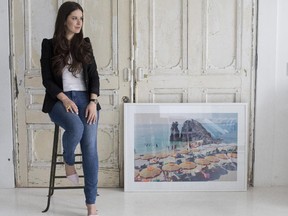 Alessandra Salituri, owner of online art gallery Citizen Atelier, is seen with some art work she sells, in Montreal, Thursday October 16, 2014.