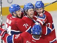 The Canadiens' P.A. Parenteau, centre, celebrates with teammates Alexei Emelin, left, Alex Galchenyuk, right, and P.K. Subban after scoring a goal against the Boston Bruins during game at the Bell Centre on Oct. 16, 2014.