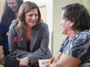 Pictured here in October 2013 — Angela Mancini, left, won back her seat as chair of the EMSB in the Nov. 2, 2014 school board elections.