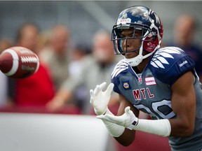 Alouettes receiver Duron Carter catches a pass during warmup before CFL game against the Hamilton Tiger-Cats at Montreal's Molson Stadium on Sept. 7, 2014.