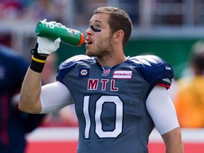 Montreal Alouettes safety Marc-Olivier Brouillette has a drink of water during warm-ups prior to Canadian Football League game against the Hamilton Tiger Cats in Montreal Sunday September 07, 2014.