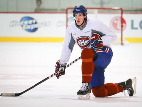 Michael McCarron, the Canadiens' first-round draft pick in 2013, takes a knee during drills at the team's practice facility in Brossard on Sept. 18, 2013.