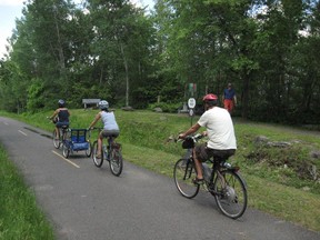 A family cycles along the Estriade path east of Granby, part of the Route verte.