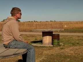 One of the men who came to Williston, N.D. looking for work contemplates the prairie in the documentary film The Overnighters.