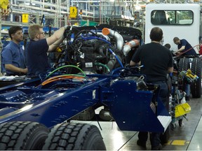 PACCAR workers on the assembly line.