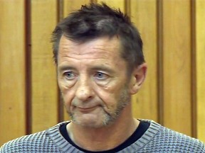 This still frame grab taken on Nov. 6, 2014. and provided by TVNZ shows the drummer with legendary rock band AC/DC, Phil Rudd, attending a hearing in court in Tauranga, New Zealand.