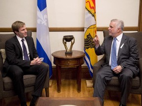 New Brunswick Premier Brian Gallant, left, chats with Quebec Premier Philippe Couillard, Tuesday, November 25, 2014 at the legislature in Quebec City.