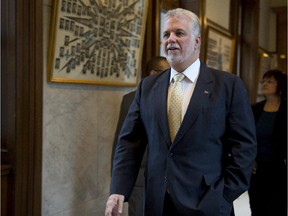 Quebec Premier Philippe Couillard walks to a cabinet meeting Wednesday, November 12, 2014 at the legislature in Quebec City.