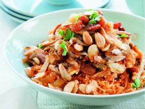 Plau B'jeej Chicken with Almonds and Raisins over Red Rice. from Israeli food writer Janna Gur's new book, Jewish Soul Food: From Minsk to Marrakesh. credit: Schocken Books. for susan schwartz story, Nov. 19, 2014