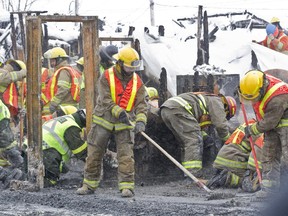 Police, firefighters and other investigators comb through the rubble of the Résidence du Havre seniors' home in L'isle-Verte, Tuesday January 28, 2014.