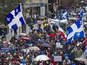 Supporters in favour of Quebec's proposed charter of values take part in a march in Montreal, Saturday, October 26, 2013.