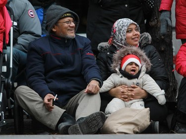 Kabir Chowdhury enjoyed the 64th edition of the Santa Claus parade on Ste. Catherine St. with his daughter Rafia and granddaughter Reyhan in Montreal Saturday, November 22, 2014.