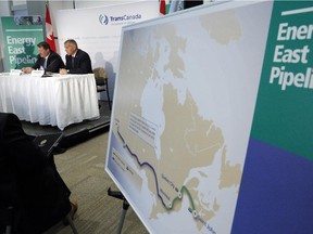 TransCanada CEO Russ Girling, right, and TransCanada president of energy and oil pipelines Alex Pourbaix announce the company is moving forward with the 1.1 million barrel-per-day Energy East Pipeline project at a news conference in Calgary, Alta., Thursday, Aug. 1, 2013.
