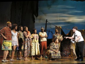 Scene from The Book of Mormon.

Actor Christopher John O'Neill (far right), as Elder Cunningham,
preaches his version of the Gospel in Africa
THE BOOK OF MORMON National Tour Company
THE BOOK OF MORMON National Tour
(c) Joan Marcus, 2013