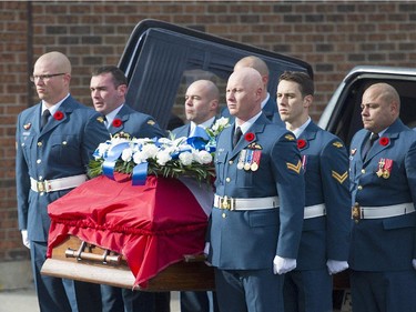 The casket containing the remains of warrant officer Patrice Vincent arrives for his funeral in Longueuil, Que., Saturday, November 1, 2014.