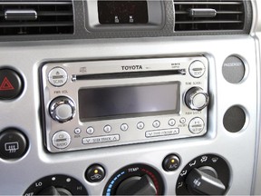 The FJ Cruiser Trail Teams Special Edition features a modern AM/FM head unit with CD, MP3/WMA, and Bluetooth capabilities. It also features integrated SiriusXM Satellite Radio. [PNG Merlin Archive] ORG XMIT: POS2014061611404812