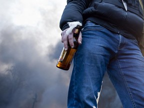 A protester with a Molotov cocktail.