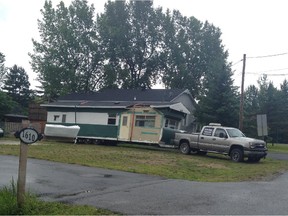 Trailer is pulled from Allan Bassenden's lot at 1610 Leduc St. in St-Lazare on Aug. 14, 2014.
