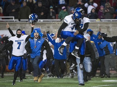 The Montreal Carabins celebrate after after beating the McMaster Marauders in the CIS Vanier Cup football final in Montreal Saturday, November 29, 2014.