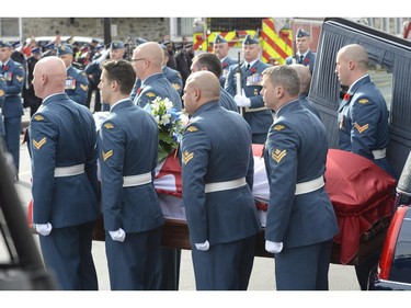 Warrant officer Patrice Vincent's casket is brought into a cathedral in Longueuil, Saturday, Nov. 1, 2014. The 53-year-old Vincent was killed after being hit by a car driven by an attacker with known jihadist sympathies on Oct. 20 in the parking lot of a shopping mall in Saint-Jean-sur-Richelieu, southeast of Montreal.