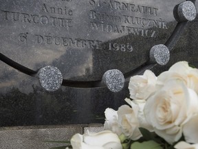 A plaque commemorates the 14 women who were targeted in the Dec. 6, 1989, massacre at École Polytechnique in Montreal.
