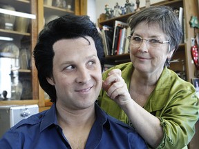 Rachel Tremblay, left, makes adjustments on a wig worn by Jay Dupuis, middle, an Elvis impersonator. Rachel runs Cybele Perruques, a wig maker for people like the Cirque du Soleil and several Elvis impersonators.