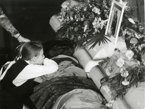 A girl mourns at the coffin of Genevieve Bergeron, one of the 14 women killed in the Dec. 6, 1989, massacre.
