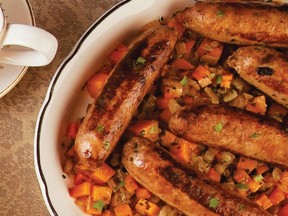 A one-pot meal combines squash and onions with sausages in a recipe from a new squash cookbook.