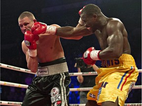 Adonis Stevenson hits Dmitri Sukhotskiy with a right hand during WBC light- heavyweight championship fight on Dec. 19, 2014 at the Pepsi Colisée in Quebec City. Stevenson won by KO.