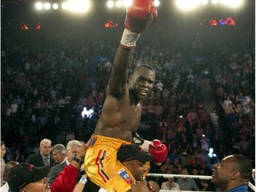 Adonis Stevenson celebrates after defeating Tavoris Cloud to defend his IBF light- heavywieght title on Sept. 28, 2013 at the Bell Centre.