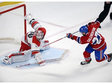 Montreal Canadiens centre Alex Galchenyuk (27) scores his second of three goals on Carolina Hurricanes goalie Cam Ward (30) during third period National Hockey League action Tuesday, December 16, 2014 in Montreal.
