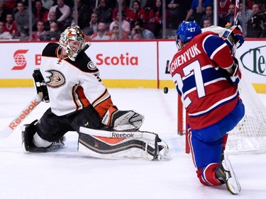 Alex Galchenyuk (#27) of the Montreal Canadiens shoots the puck wide past Frederik Andersen (#31) of the Anaheim Ducks during the NHL game at the Bell Centre on December 18, 2014 in Montreal, Quebec, Canada.